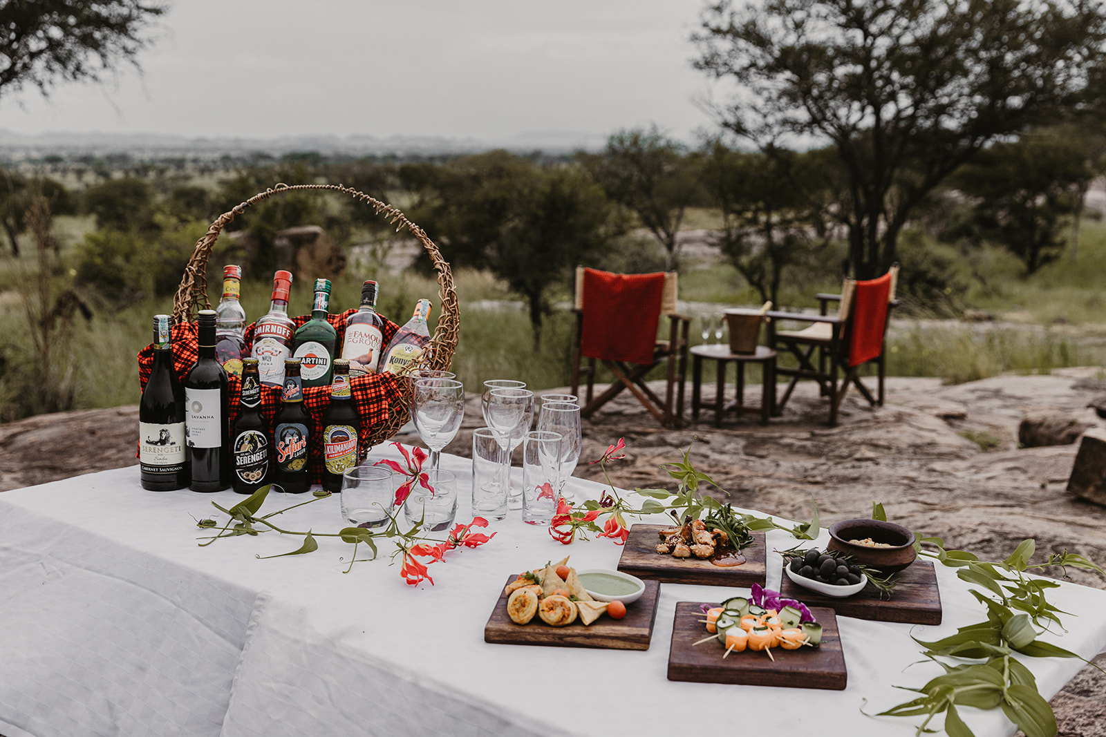 Private sundowner setup with drinks, snacks and scenic Serengeti views in Tanzania.