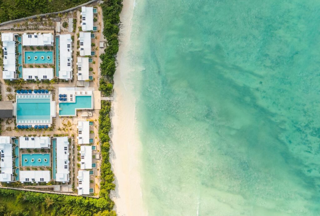 Legendary Zanzibar Beach Resort from above with the turquoise sea on the right, the beach in the middle and the resort on the left